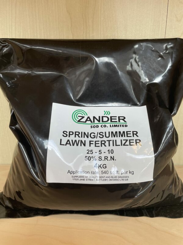 A black plastic bag of Zander Sod Co. Limited Spring/Summer Lawn Fertilizer, with a white label, formula 25-5-10, and 50% S.R.N., weighing 4kg.