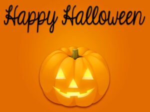 Orange background with a jack-o-lantern carved and lit with the caption "Happy Halloween"