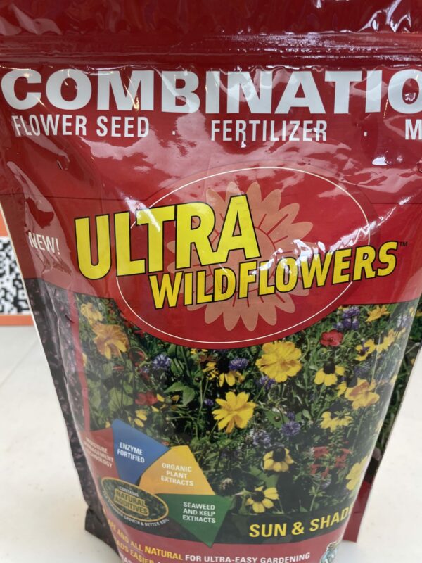 A red bag of Sun & Shade Wildflower seed, fertilizer and mulch mix